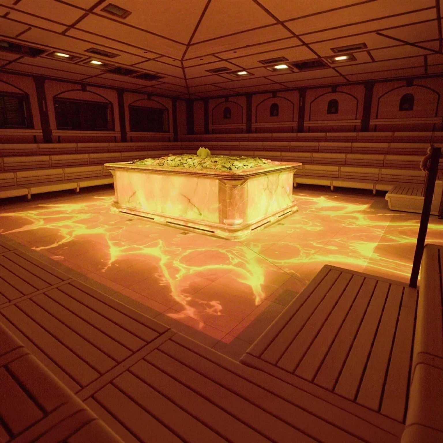 Immersive projection in a sauna: A large sauna heater stands in the center, adorned with colorful projections that also spread across the floor.
